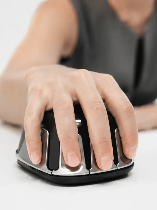 A hand resting on the Vitanya VConnect handset during a session